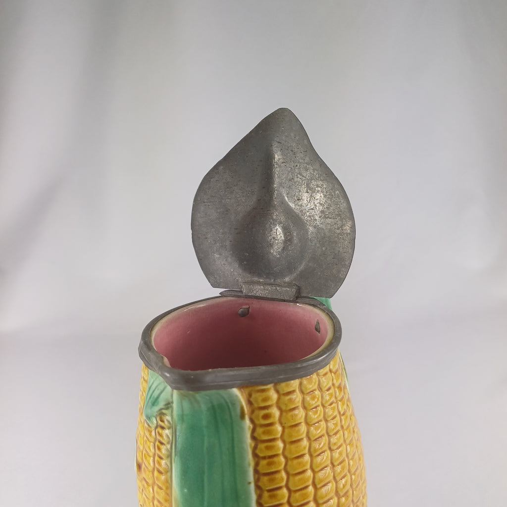 Pewter lid on a majolica Sweetcorn Jug