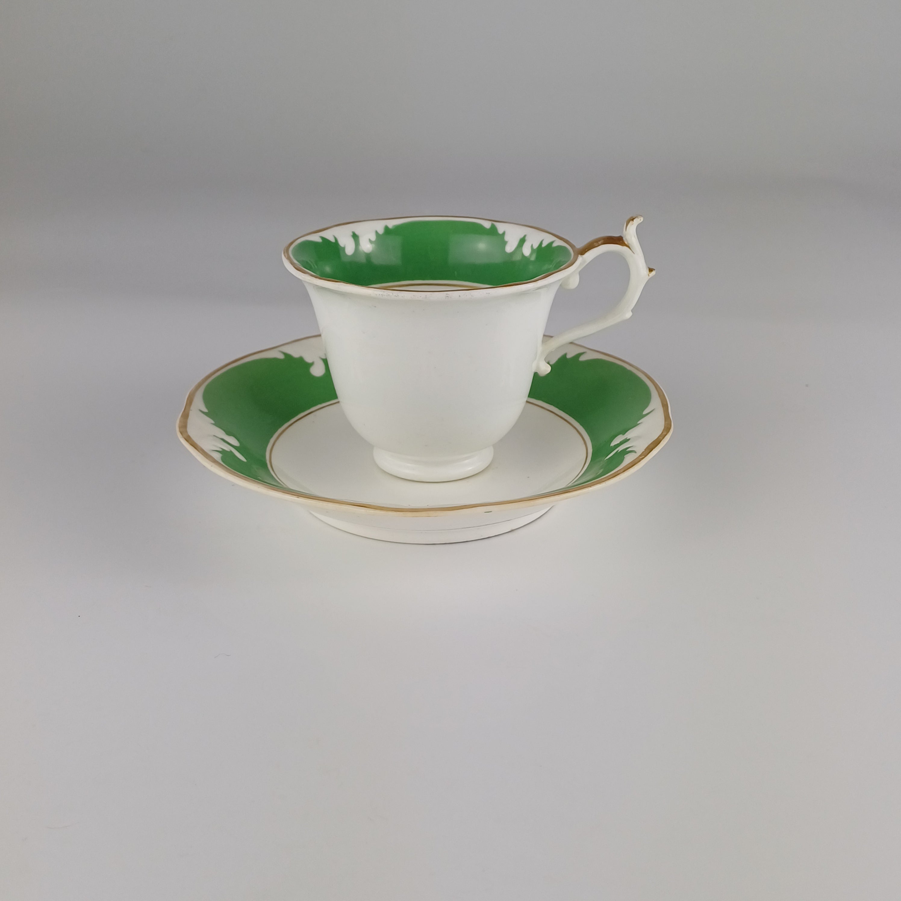 Rockingham Brameld Porcelain Green and White Teacup and Saucer c1830