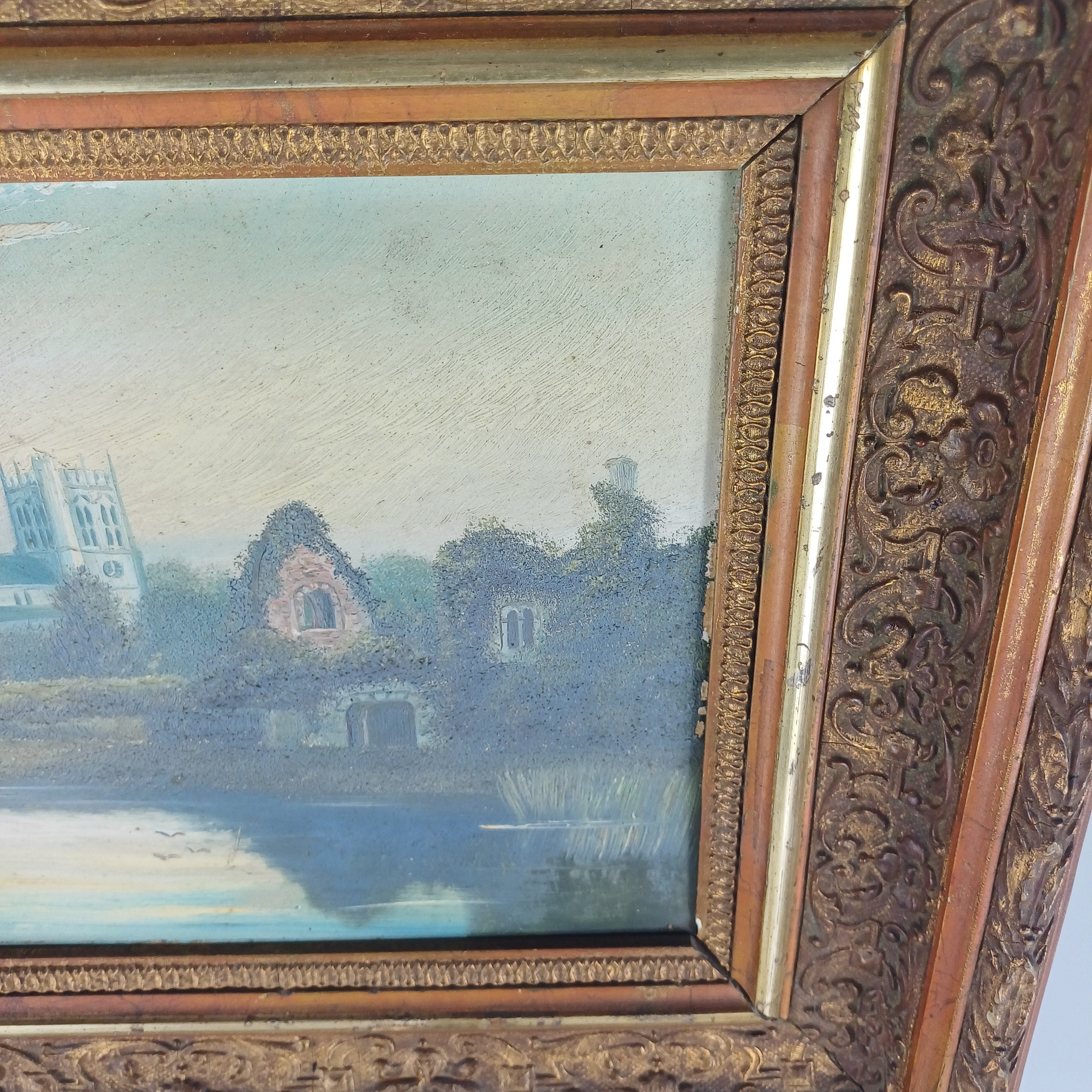 Painting on board of Christchurch Priory and the Norman House signed and dated 1905